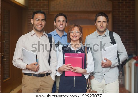 Mature college class posing smiling at camera