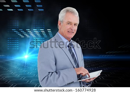 Composite image of side view of mature tradesman with tablet computer against a white background