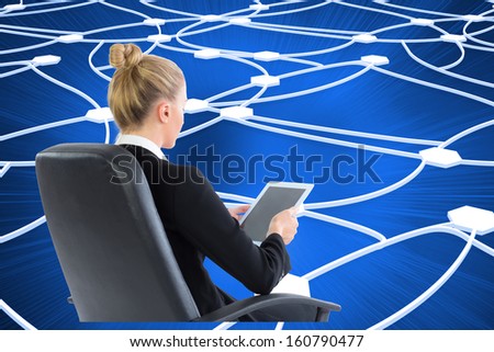Composite image of blonde businesswoman sitting on swivel chair with tablet