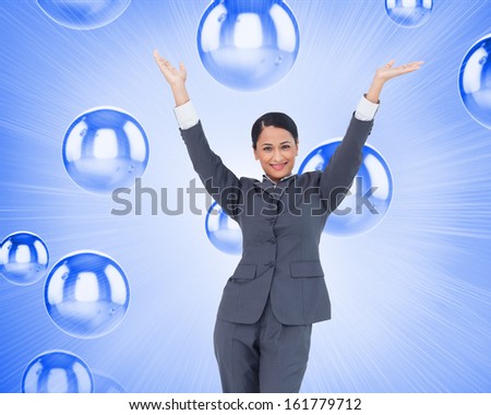 Composite image of cheering businesswoman against a white background
