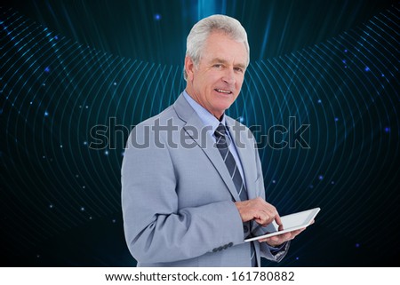 Composite image of side view of mature tradesman with tablet computer