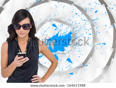 Composite image of happy attractive brunette using smartphone