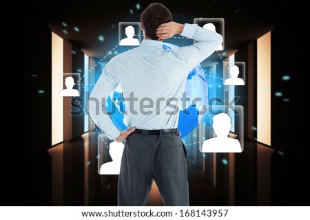 Thinking businessman with hand on head against bright white hall with windows