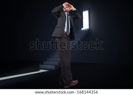Shouting businessman against door opening revealing light at top of steps