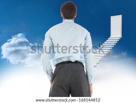 Businessman standing with hand in pocket against steps leading to closed door in the sky