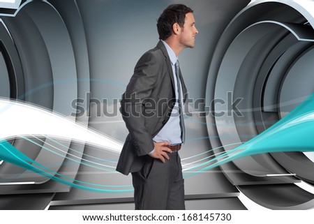 Smiling businessman with hands on hips against blue wave design