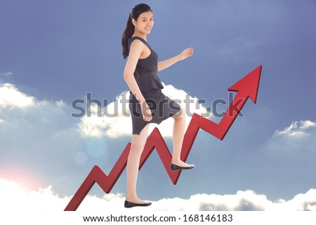 Businesswoman stepping up against red jagged arrow pointing up against sky