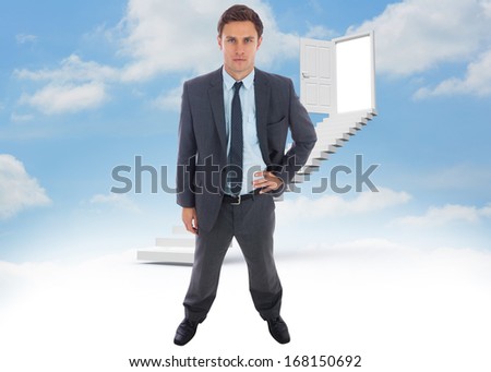 Stern businessman standing with hand on hip against steps leading to open door in the sky