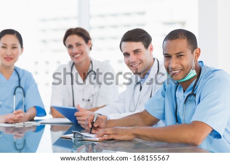 Portrait of a group of young doctors in a meeting at hospital