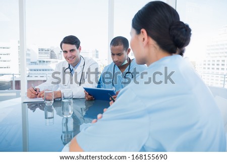 Group portrait of young doctors in a meeting at hospital