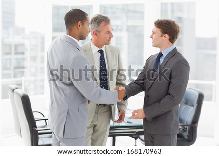 Businessman introducing new colleagues in the office