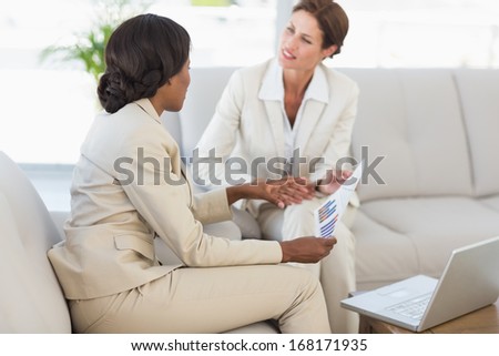 Businesswomen having a meeting on the couch in the office
