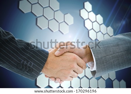 Composite image of business handshake against technological background with hexagons