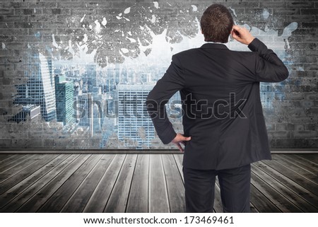 Thinking businessman scratching head against yellow lines with cloud design on a futuristic structure