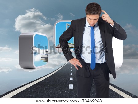 Thinking businessman scratching head against road over water reflecting sky
