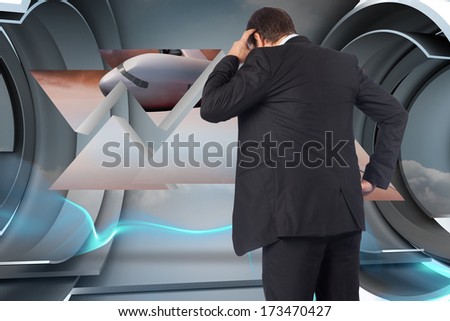 Thinking businessman scratching head against abstract design in blue