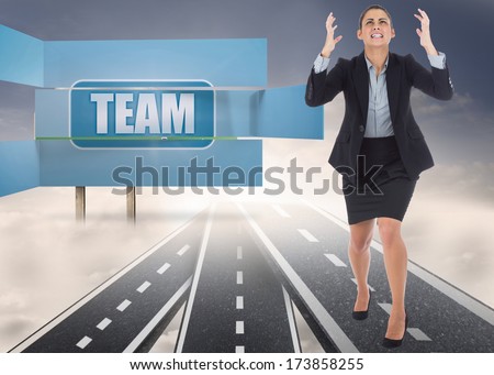 Angry businesswoman gesturing against signposts showing the road to success