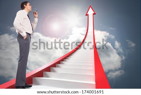 Thinking businessman holding glasses against red stairs arrow pointing up against sky
