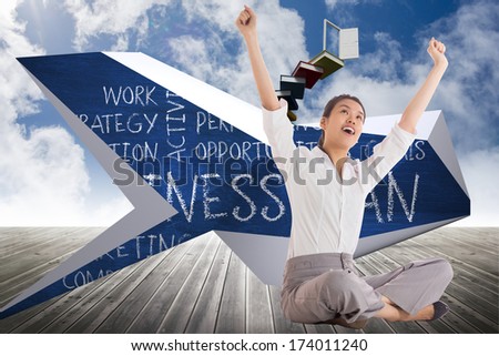 Businesswoman sitting cross legged cheering against book steps leading to door on sky