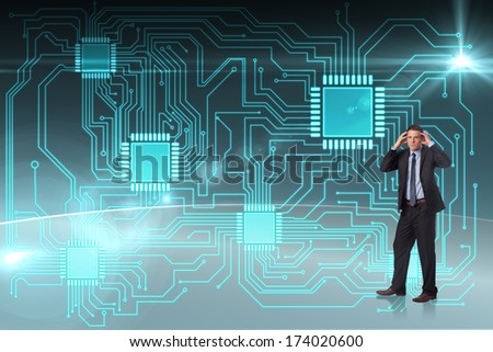 Stressed businessman with hands on head against circuit board graphic