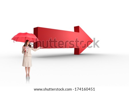 Attractive businesswoman holding red umbrella against red arrow