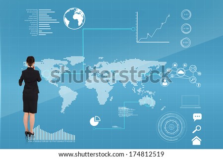 Thoughtful businesswoman pointing against futuristic technology interface