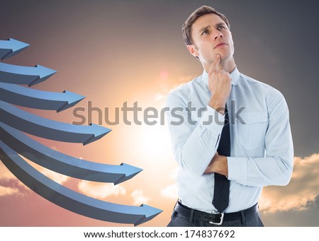 Thinking businessman with finger on chin against blue curved arrows pointing against sky