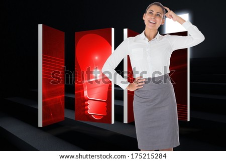 Smiling thoughtful businesswoman against steps leading to light in the darkness
