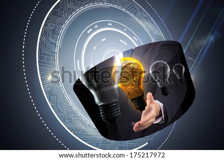 Light bulb graphic on abstract screen against black background with glowing circle