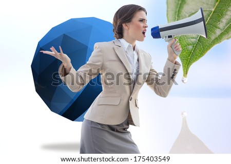 Furious stylish brown haired businesswoman shouting in a megaphone against drop on a leaf