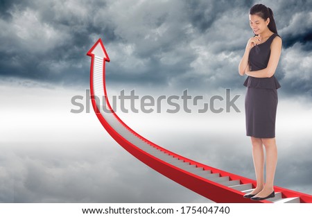 Thinking asian businesswoman against red stairs arrow pointing up against sky