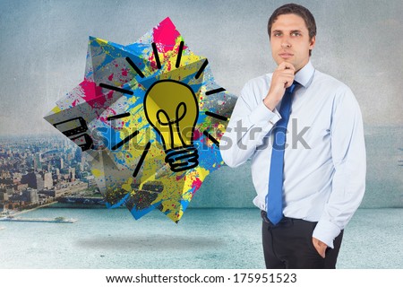 Thinking businessman touching his chin against city scene in a room