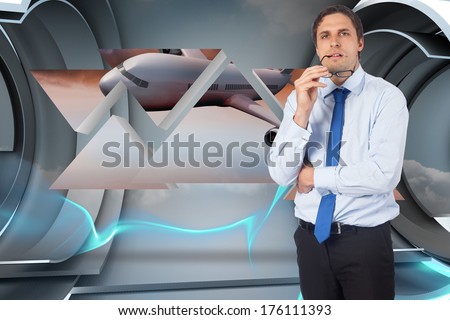 Thinking businessman biting glasses against abstract design in blue