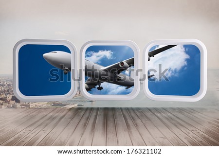 Airplane on abstract screen against city scene in a room