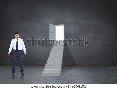 Sad tradesman showing his empty pockets against open door at top of steps