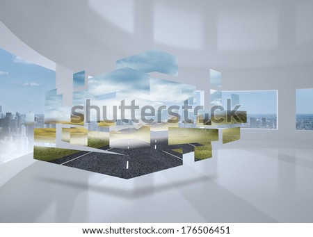 Open road on abstract screen against bright white room with windows
