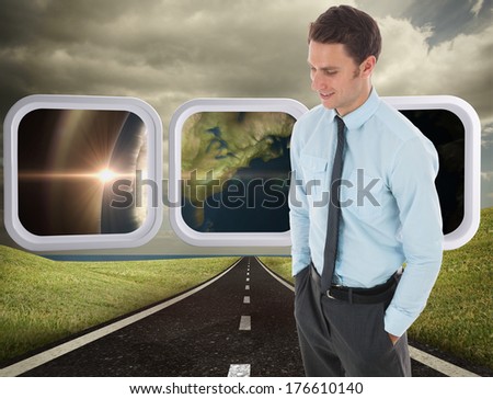 Happy businessman standing with hand in pocket against highway under cloudy sky