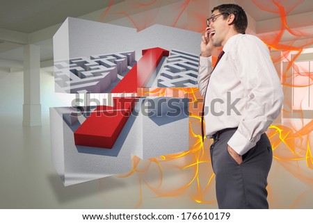 Thinking businessman touching his glasses against abstract design in orange