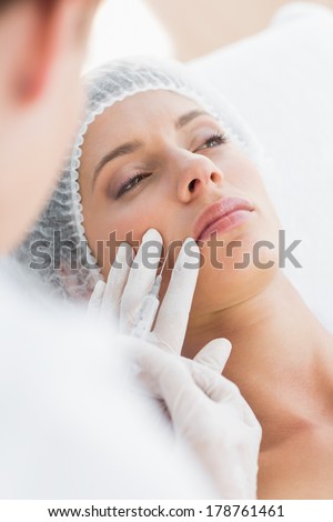 Closeup of beautiful woman recieving injection in upper lip
