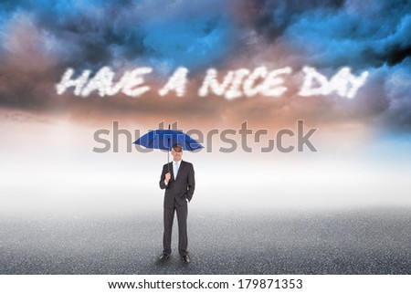 The word have a nice day and businessman smiling at camera and holding blue umbrella against cloudy landscape background
