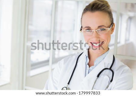 Closeup portrait of a beautiful happy female doctor in the hospital