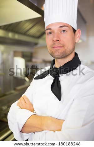 Closeup portrait of a confident male cook in the kitchen