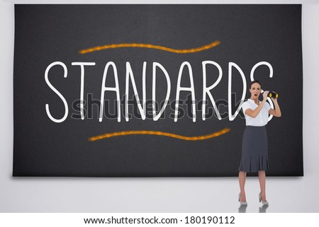 Shocked businesswoman with binoculars against the word standards