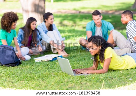 Group of university students studying on college campus