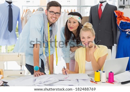 Group of fashion designers at work in a studio