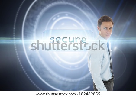 The word secure and serious businessman with hand in pocket against black background with glowing circle