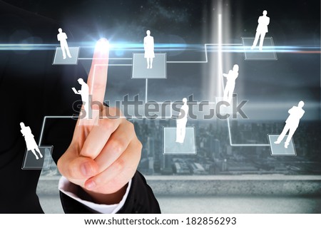 Digital composite of finger pointing to business people graphic