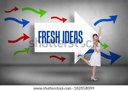 The word fresh ideas and happy and classy brunette posing against arrows pointing