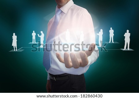 Digital composite of businessman presenting links between human representations