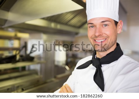 Closeup portrait of a smiling male cook in the kitchen